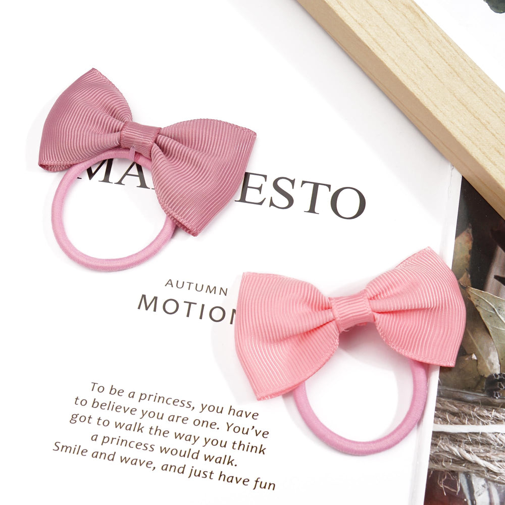 Cellot closeup bow ribbon texture highlights classic pastel hues