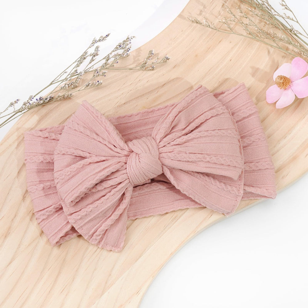 Cellot family-photo-ready bow adds cute detail to special moments.