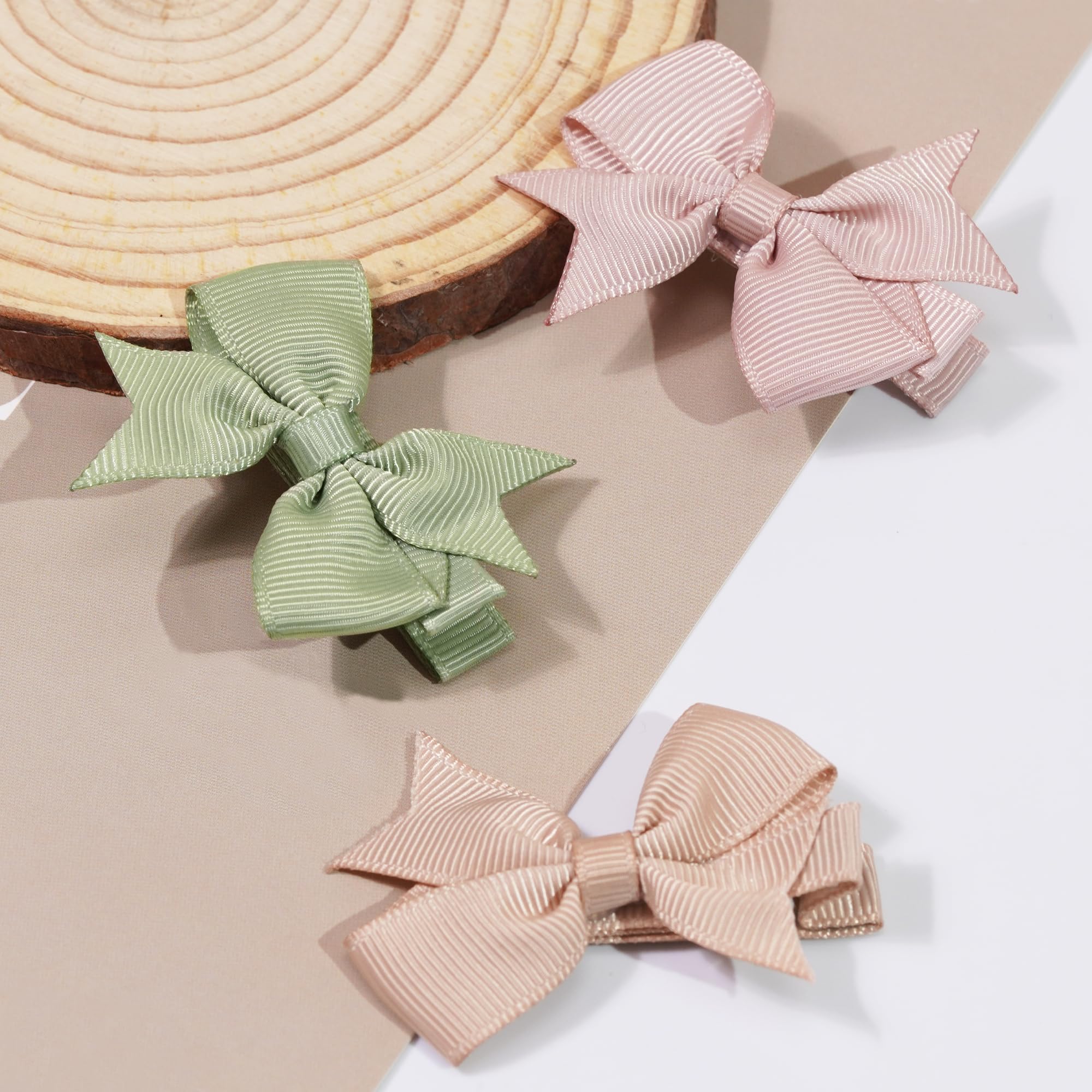 CÉLLOT handmade quality bows with fabric-covered clips for durable daily wear