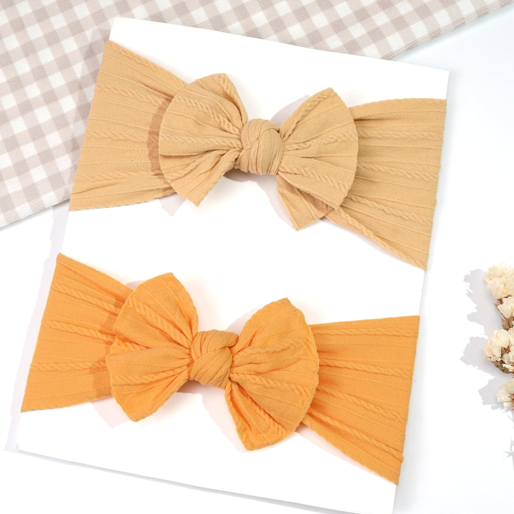 CÉLLOT red bow headband, bright accent for newborns and infants alike.