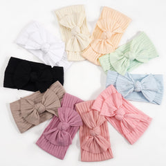 Cellot khaki headband knot blends with neutral looks