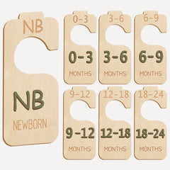 Cephira baby closet divider set in wood sage-green shows organized nursery storage for quick outfit prep.