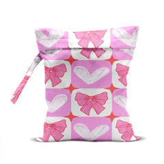 CFGBFDGH Pink Bow Wet Bag front view for compact travel organization of swimsuits and toiletries