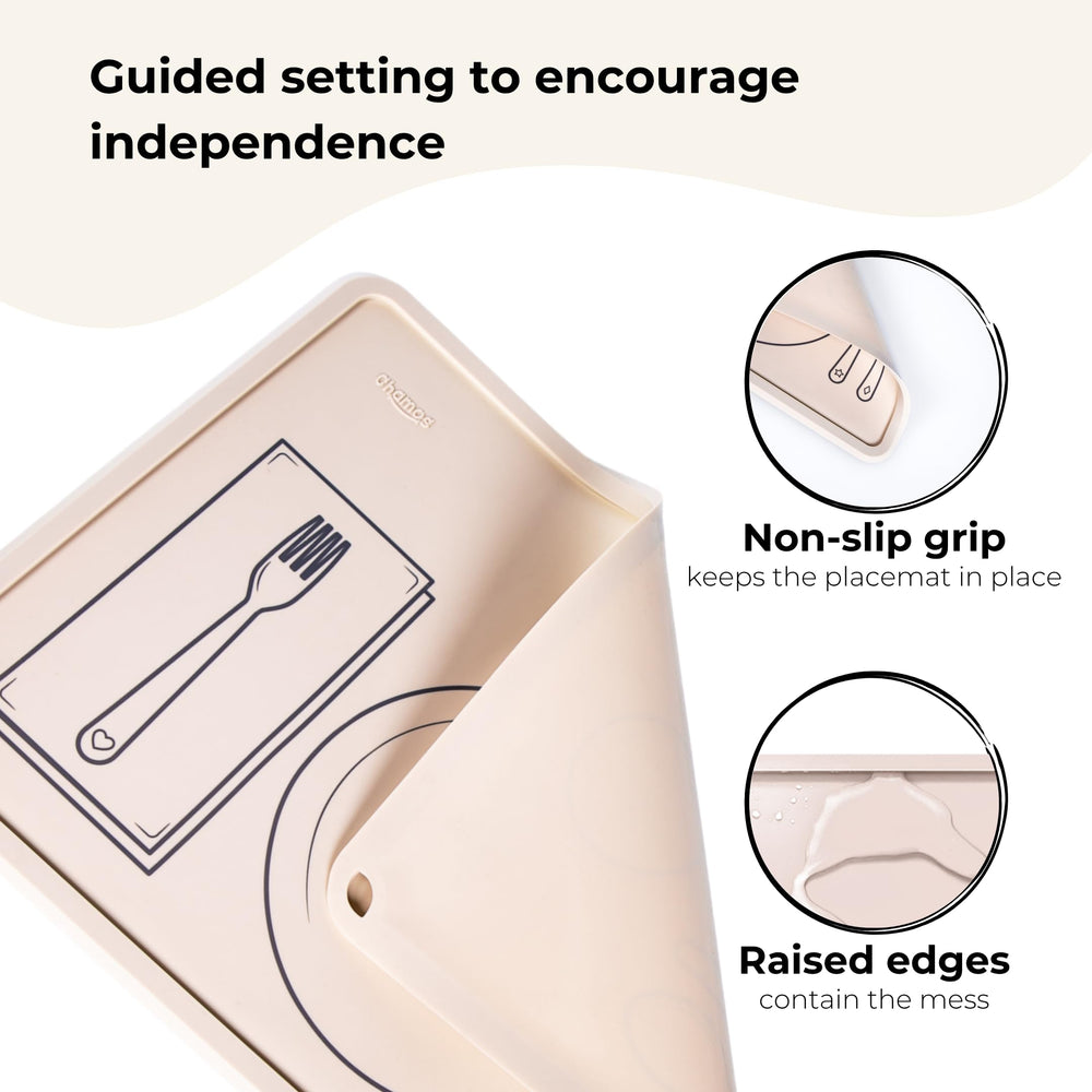 Chamos placemat on table showing simple setting outlines for self-feeding.