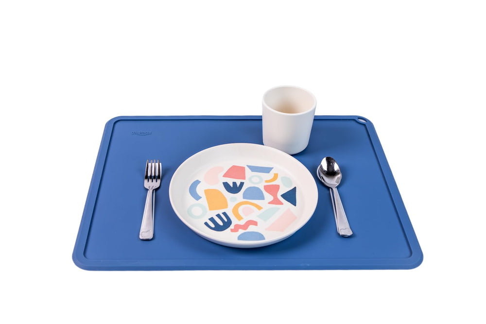 Chamos sapphire and gray placemats add color while encouraging organized dining.