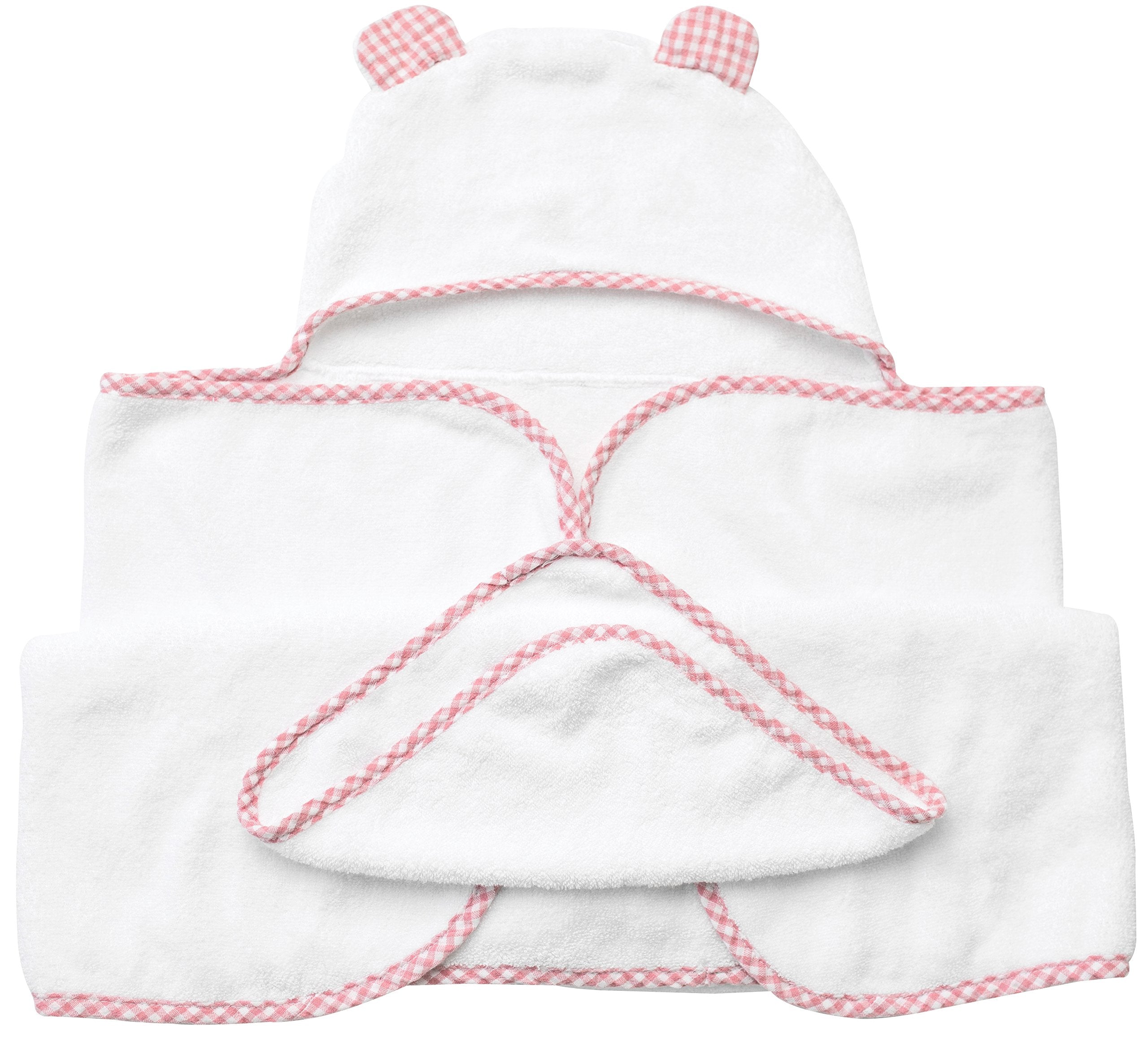Pink towel draped on baby for cozy post-bath wrap.