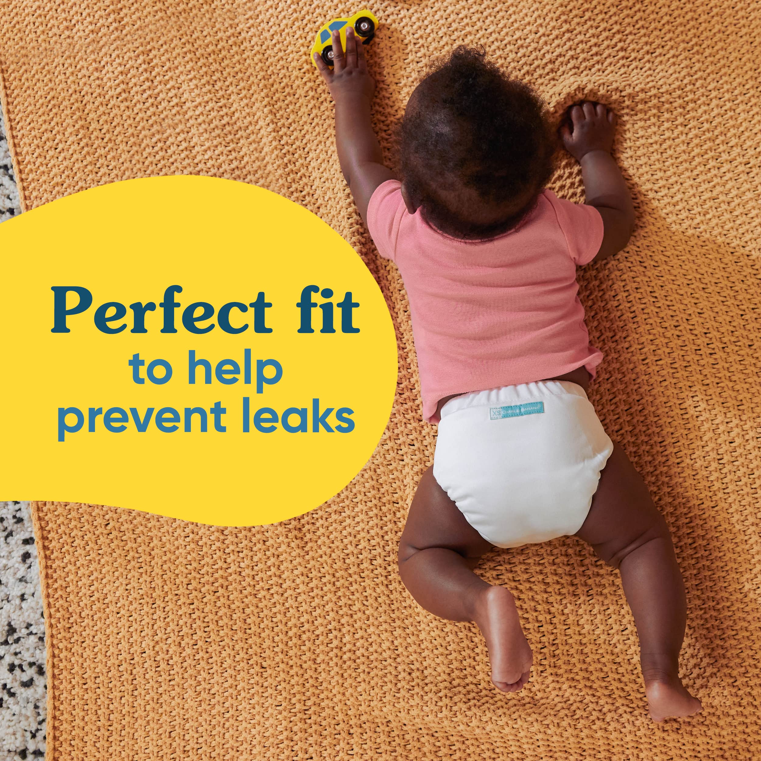 Charlie Banana diaper sports stylish prints for a playful look.