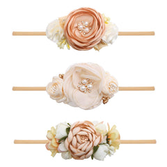 Cherrboll baby flower headband in soft nylon for newborn comfort and secure fit.