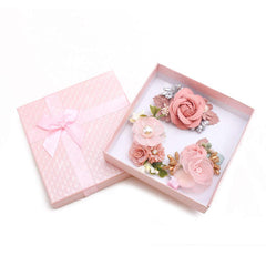 Cherrboll flower hair clip closeup highlights handmade petals and pearl accents.