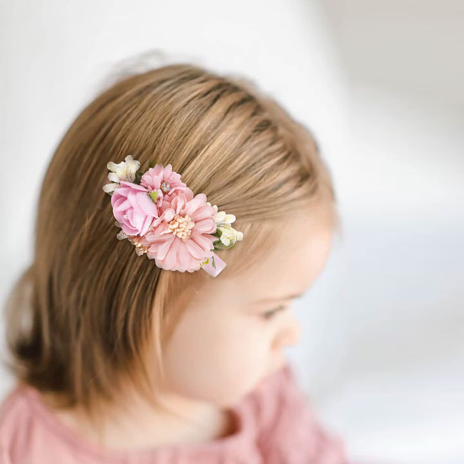 Cherrboll mint-pattern clip in a little girl's hair for everyday outfits.