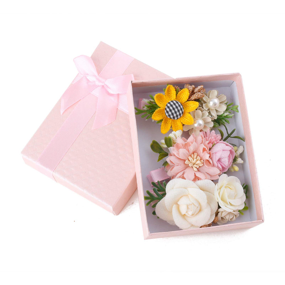 Cherrboll peach-pattern flower clip on toddler's hair adds playful charm.