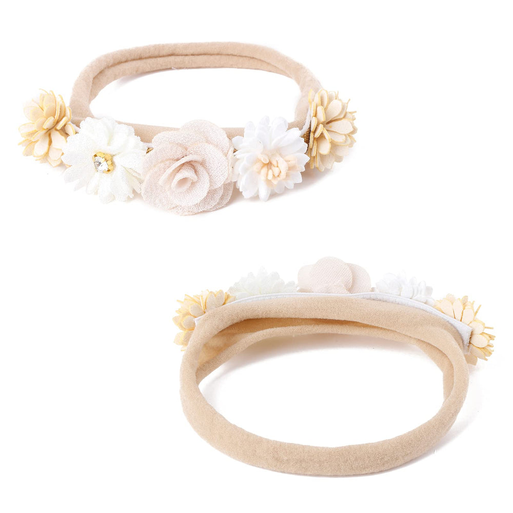 cherrboll flower headbands on a toddler during outdoor play