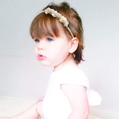 Cherrboll headbands on a baby girl ready to complement outfits and photos.