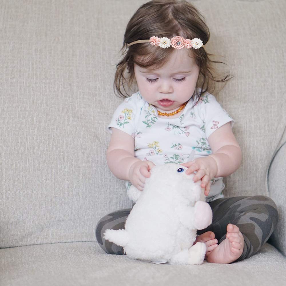 cherrboll stretchy headband newborn closeup demonstrates 100% elasticity for long wear