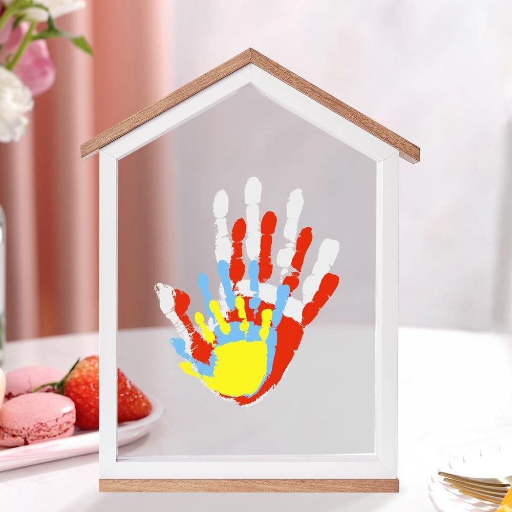 CHERRY CHEERS family handprint setup highlights a cherished memory in a colorful frame.