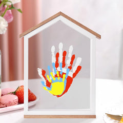 CHERRY CHEERS family handprint setup highlights a cherished memory in a colorful frame.