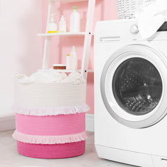 CherryNow knot-tie handles on a baby laundry bin for easy room-to-room use.