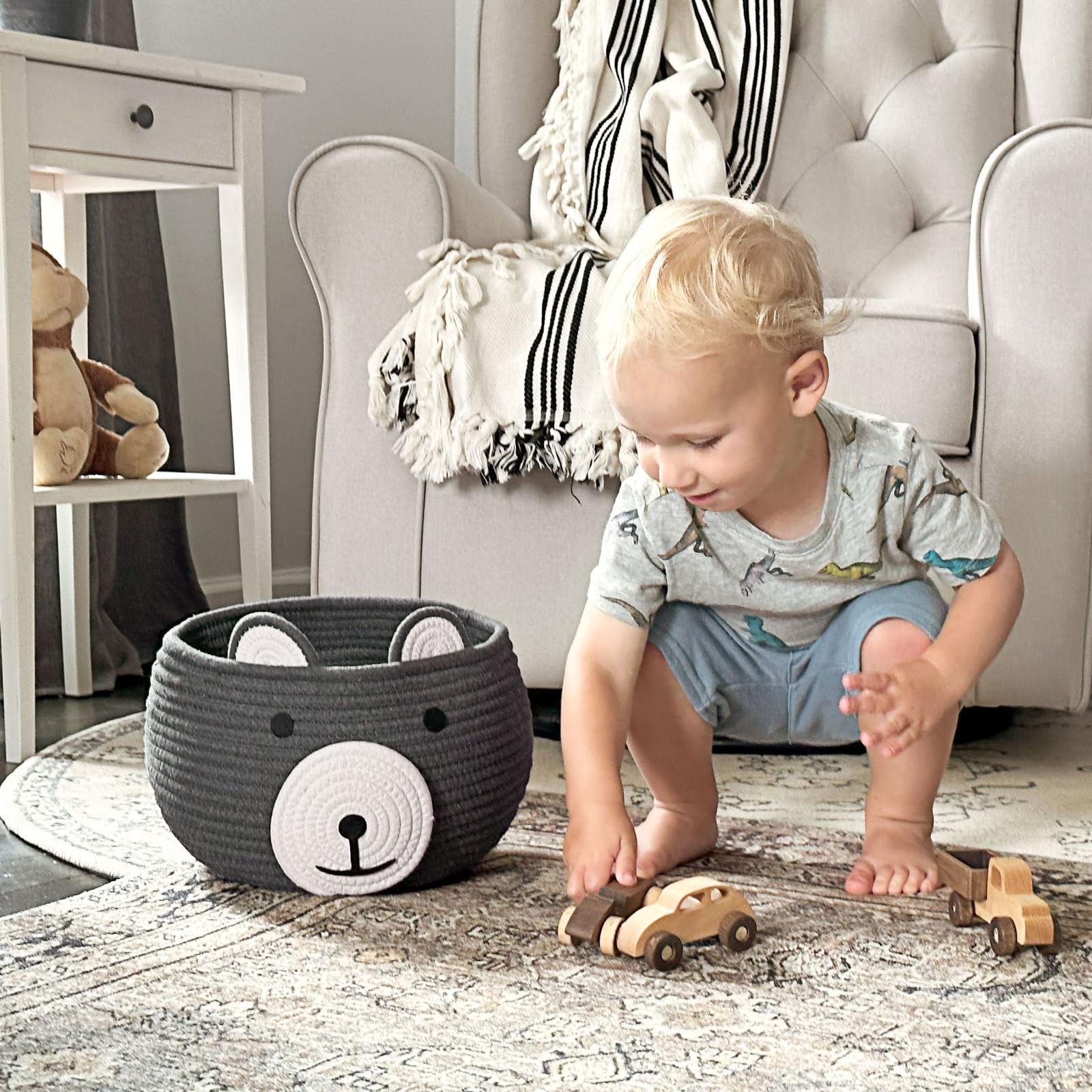 CherryNow Baby Basket handles visible for portable storage of toys and towels.
