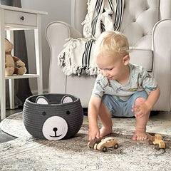 CherryNow Baby Basket handles visible for portable storage of toys and towels.