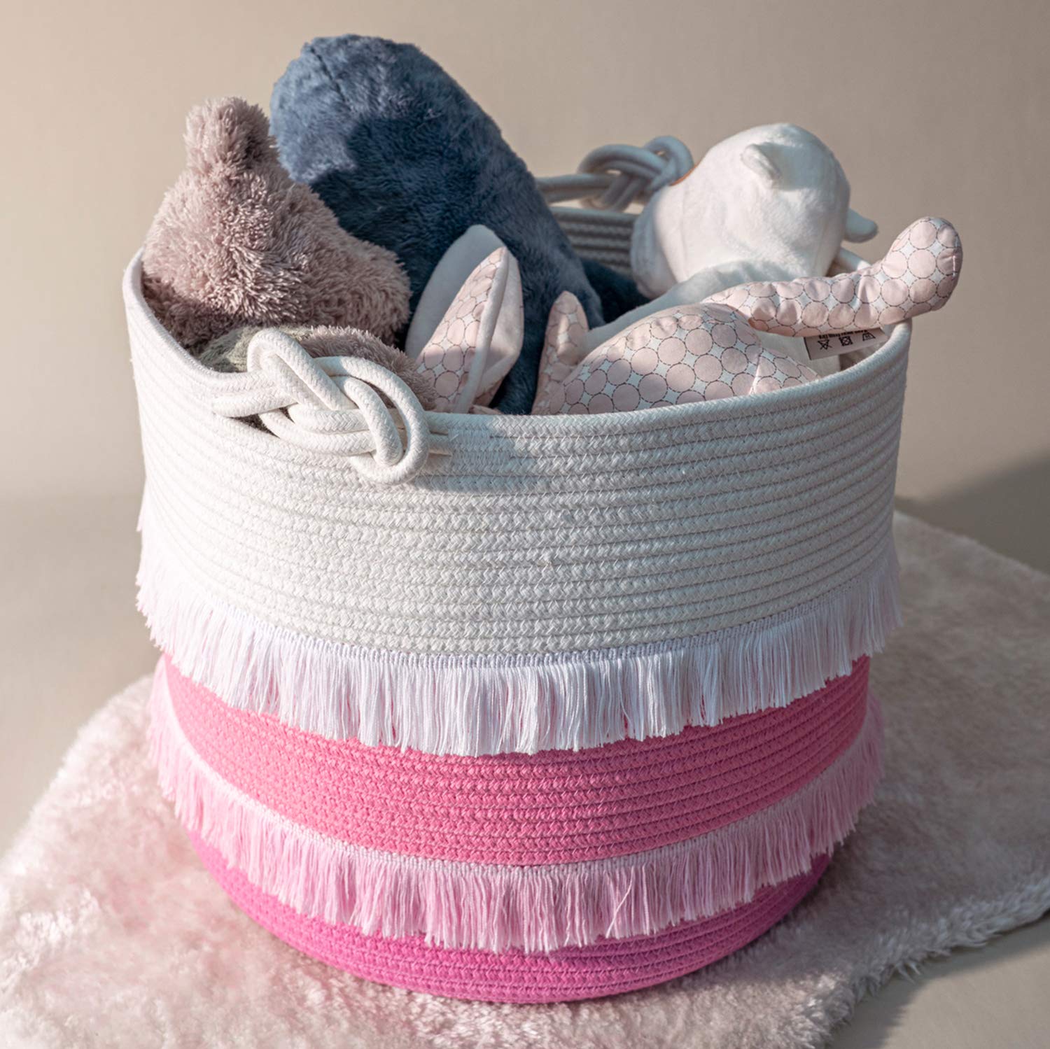 CherryNow pink basket in nursery demonstrates soft, kid-friendly storage.