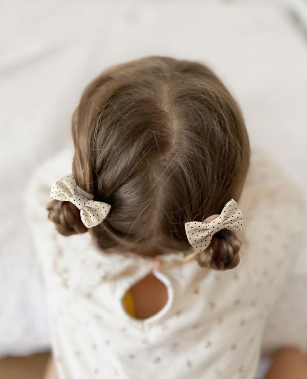 Cherssy baby hair ties on kids outfits offer coordinated style options.