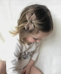 Cherssy boutique hair clip with matte ribbon shows secure alligator clip for fine hair.