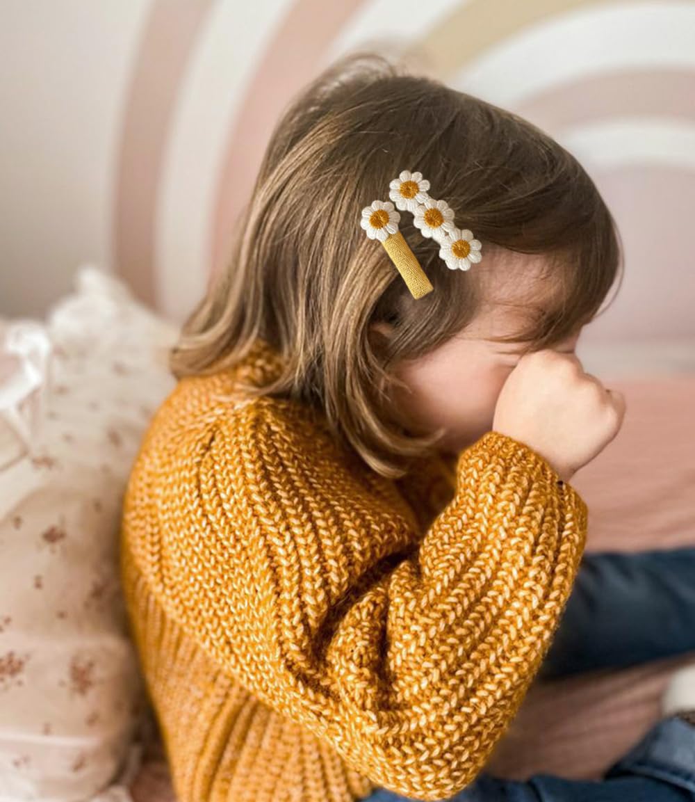 Cherssy daisy hair clip on head demonstrates secure non-slip placement.