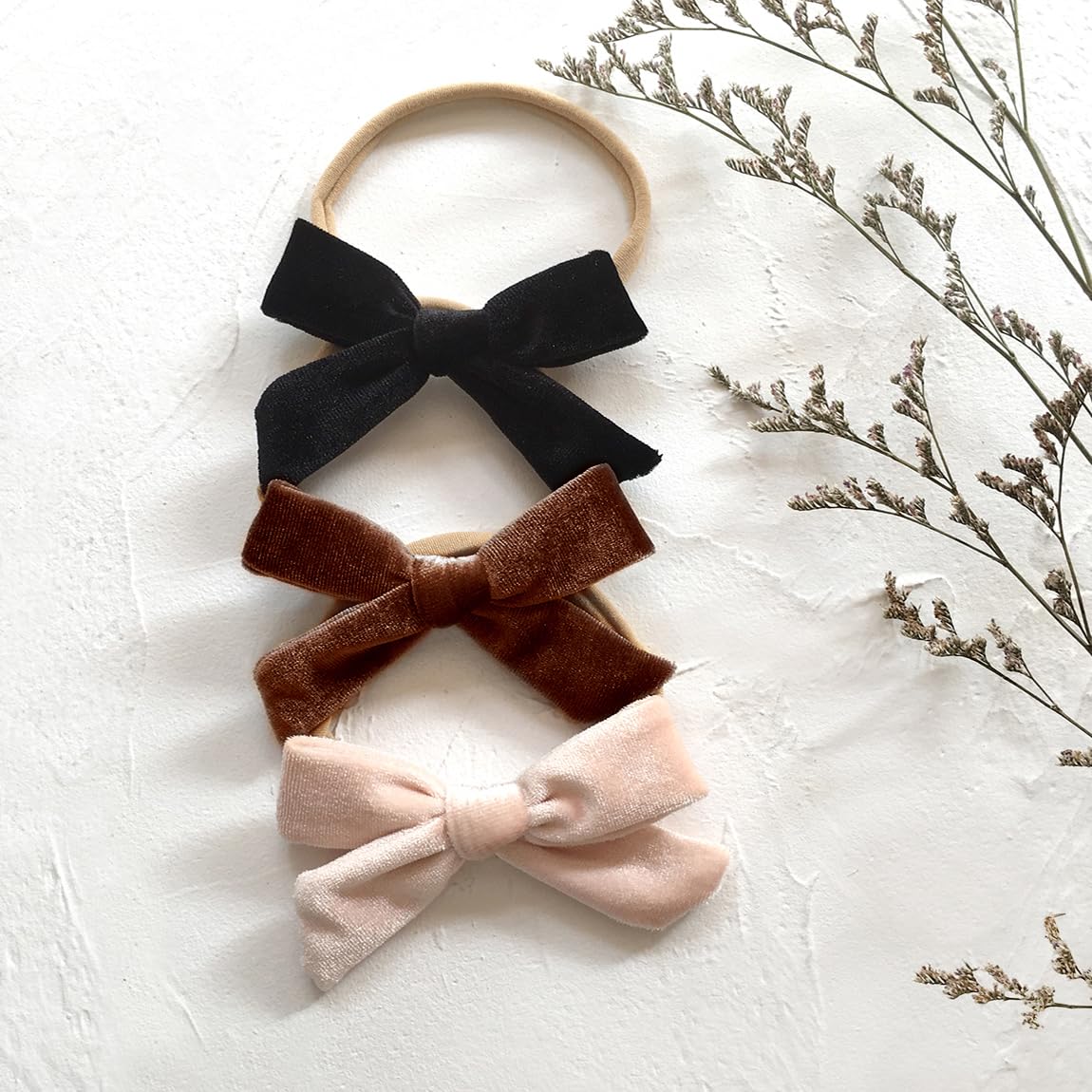 Cherssy elastic headband fits newborn to toddler for secure comfortable wear.