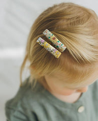 Cherssy fully lined hair clip with fabric cover protects fine hair during wear.