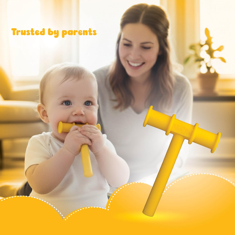 Chewy Tubes Yellow in-use infant with compact grip for bite practice