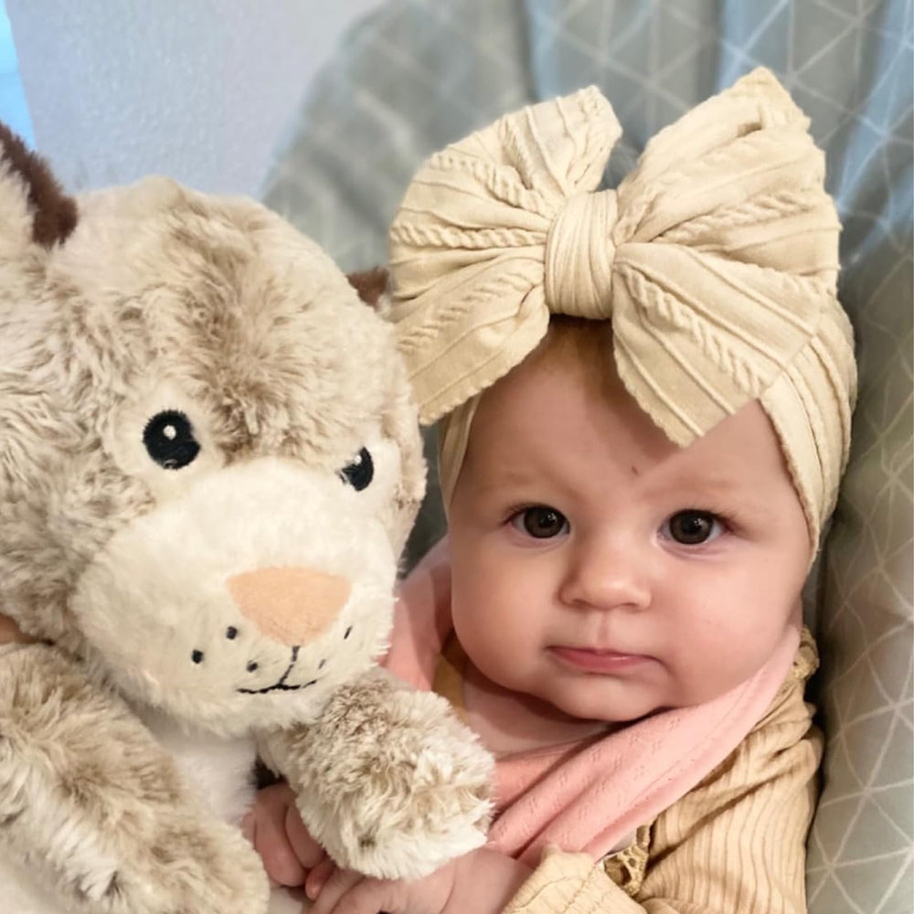 Chiduerm on-baby-head demonstrates comfortable, all-day wear for infants.