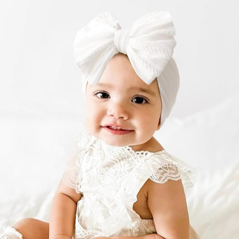 Chiduerm bow-detail headband emphasizes tidy knot and cute styling options.