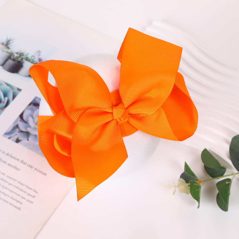 Chiduerm Halloween headband black bow on baby demonstrates secure elastic band for all-day wear