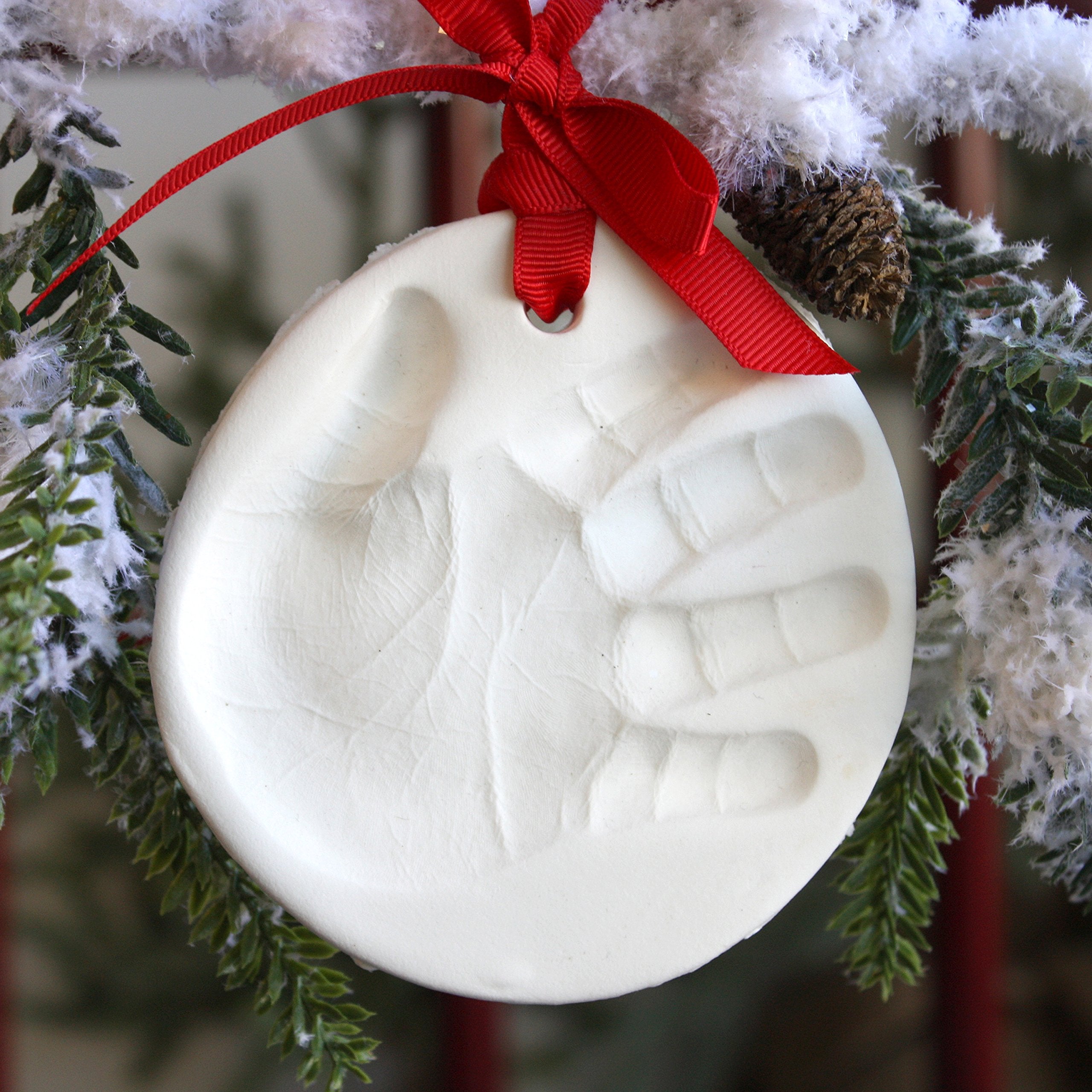 Child to Cherish finished ornament hanging on tree captures cherished family memories.