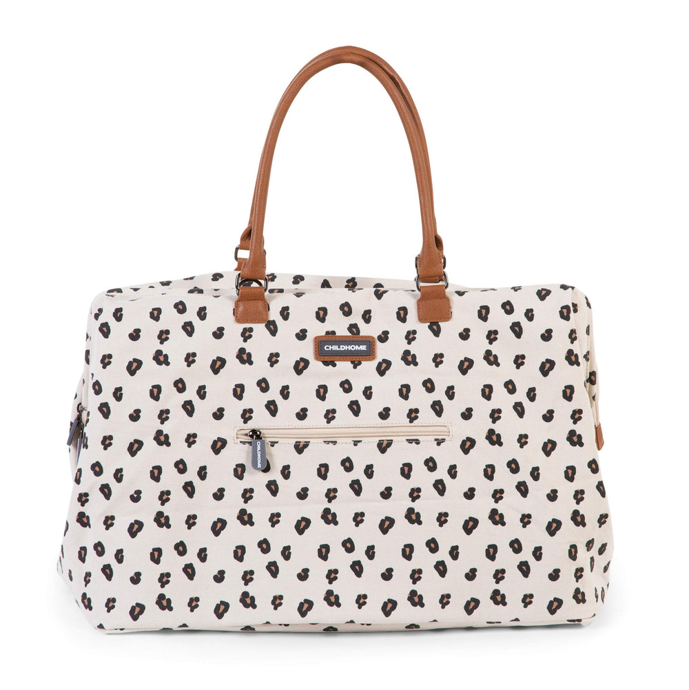Childhome Mommy Bag Canvas Leopard interior organization with pockets keeps bottles and wipes organized.