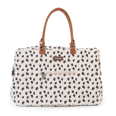 Childhome Mommy Bag Canvas Leopard interior organization with pockets keeps bottles and wipes organized.
