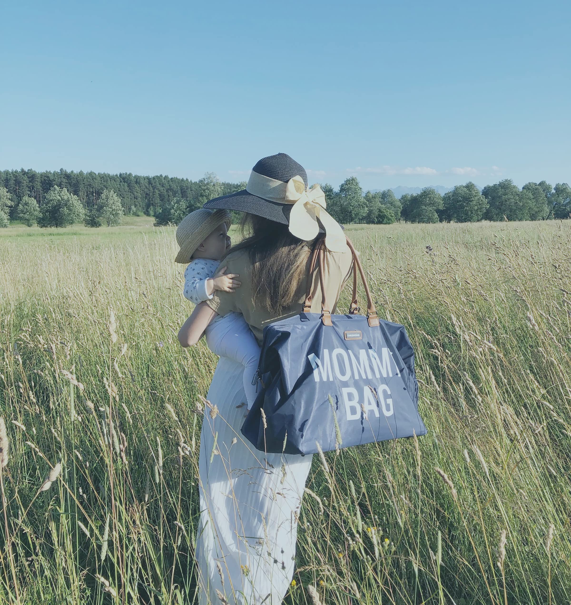 Childhome Navy Large Diaper Bag removable strap offers hands-free carrying on busy days.