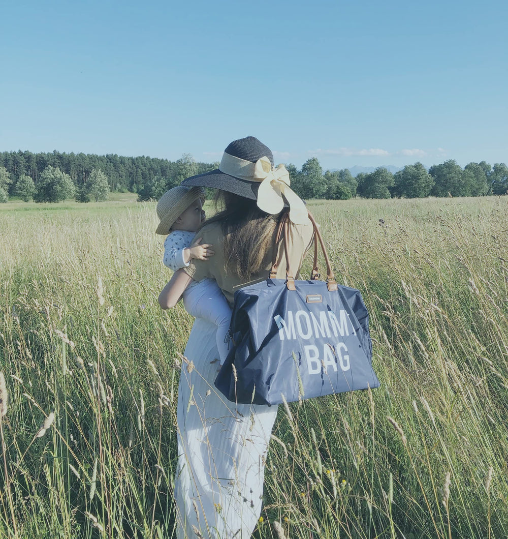 Childhome Navy Large Diaper Bag removable strap offers hands-free carrying on busy days.