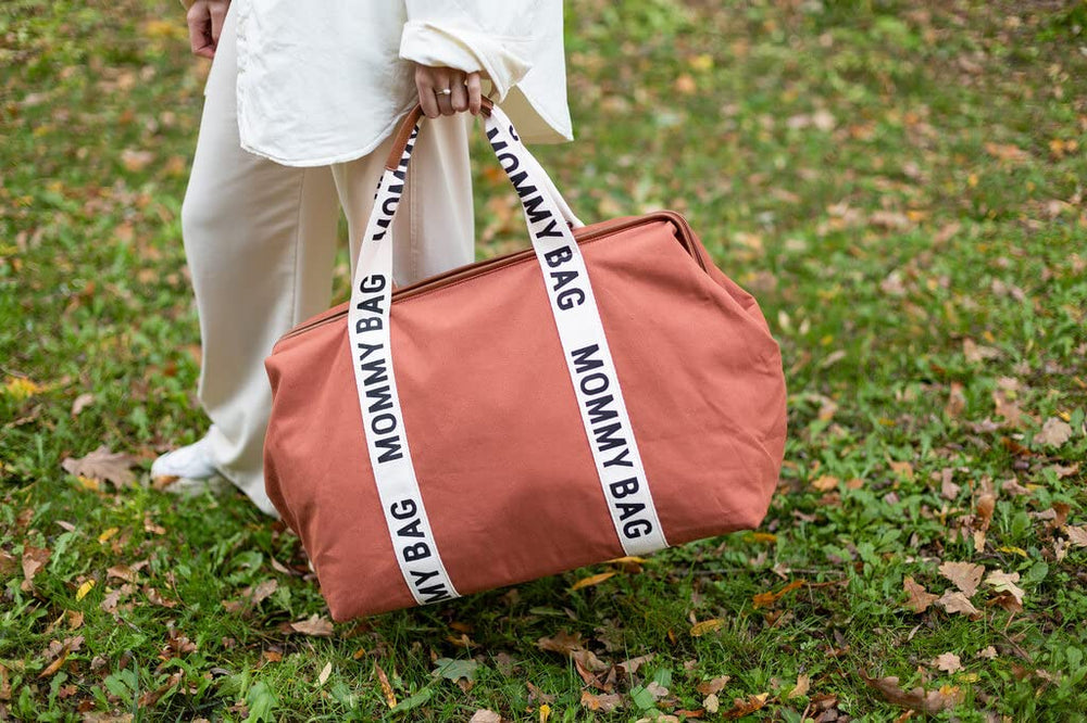 Childhome Signature Mommy Bag 58-litre capacity fits diapers, clothes, and extra gear.
