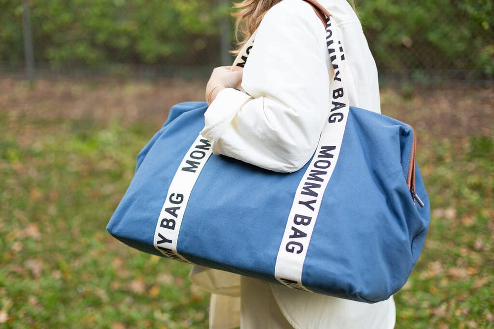 Childhome Signature Mommy Bag Indigo water-repellent fabric, resistant to light spills and rain.