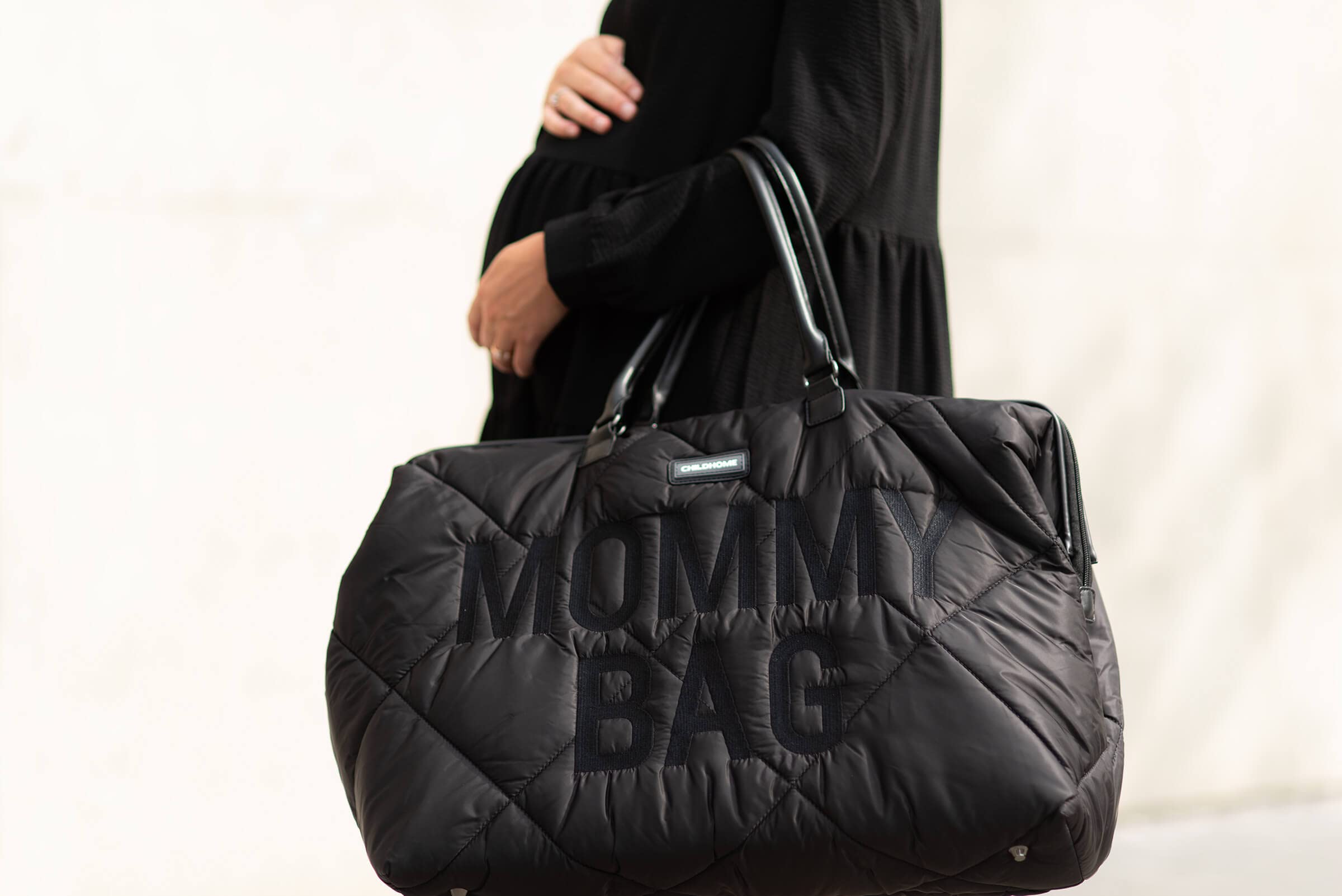 Childhome The Original Mommy Bag outer pocket provides quick-access storage.