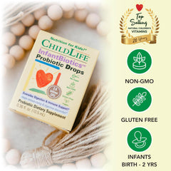 CHILDLIFE ESSENTIALS InfantBiotics drops are used with a sleeping baby to support calm digestion