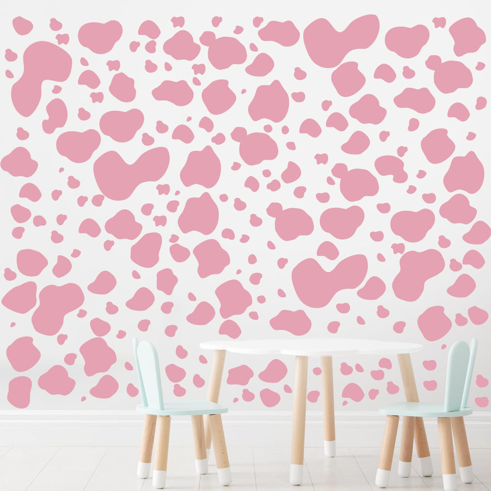 Chinco pink cow-print nursery decor example on wall