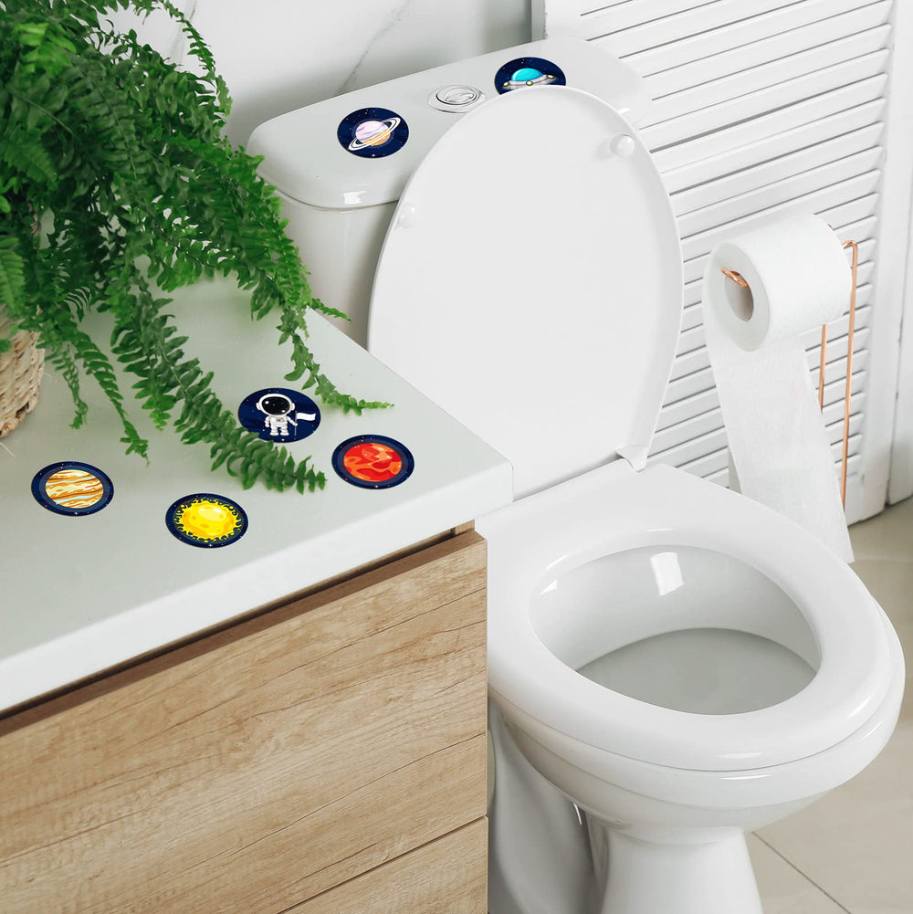 Chinco spaceship-design potty targets dissolve quickly for easy cleanup.