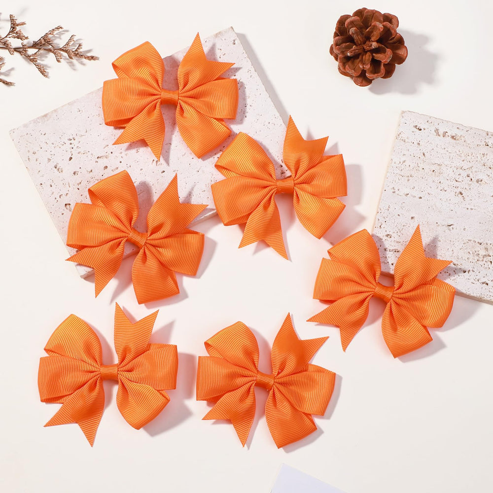 Choicbaby three inch orange bow closeup showing durable grosgrain texture
