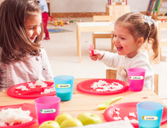 CHUBBIEE daycare-name-tags waterproof stickers show strong adhesion on plastic, ideal for classroom organization.