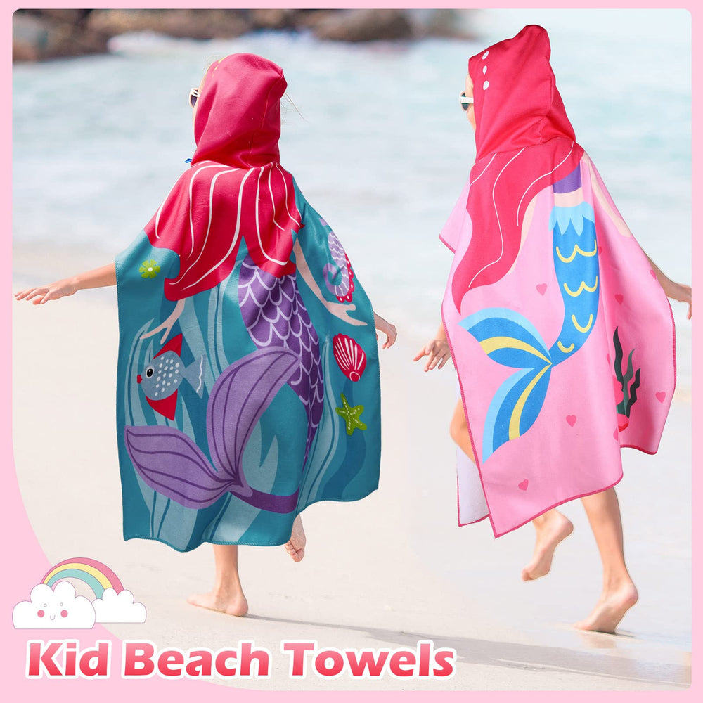 Chumia hooded poncho towel at beach with mermaid and unicorn prints.
