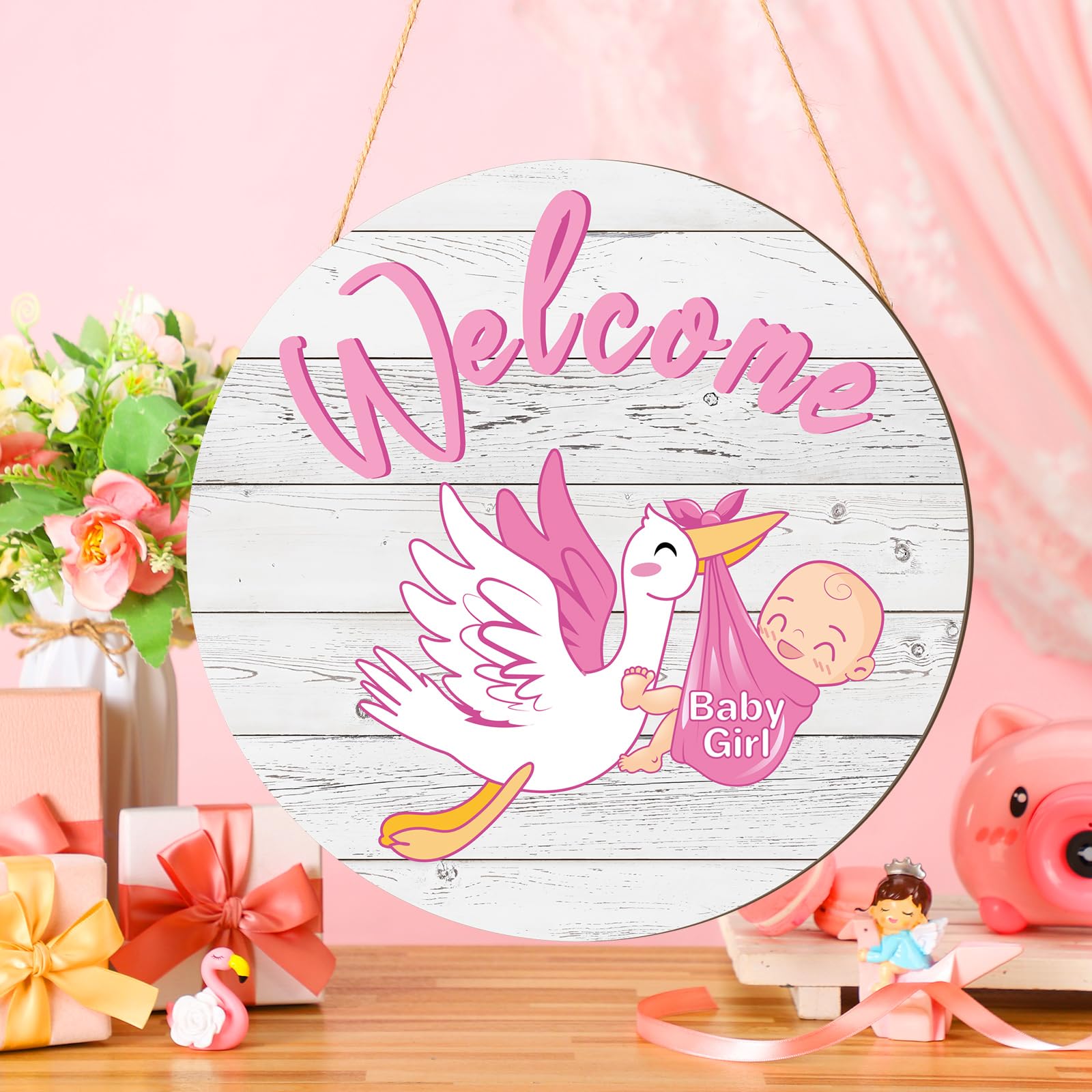Chunful baby girl door sign round on front door welcomes guests.