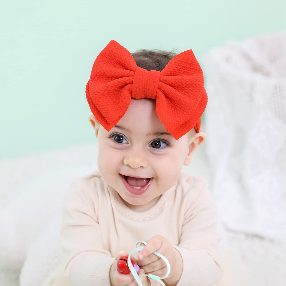 Cinaci 12-pack orange knot-bow headband for casual and festive looks