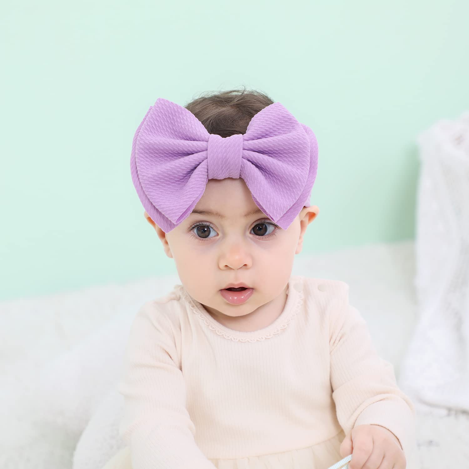Cinaci headband big bow design adds stylish focal point to outfits.